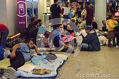 In the Budapest's international railway station, thousands of migrants waiting for taking trains to other countries of Europe Editorial Stock Photo