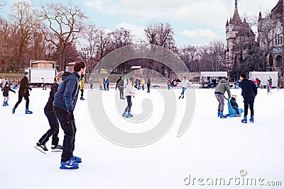 04.01.2022.Budapest.Happy little boy and girl learning to skate in winter.Hobbies and Leisure.Winter sports.Family winter sport. Editorial Stock Photo
