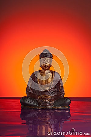 budda with red reflecting background Stock Photo