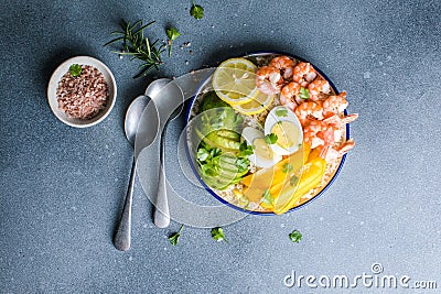 Buddha bowl with avocado, prawns, rice, on light background. Healthy food, clean eating, Buddha bowl, top view Stock Photo