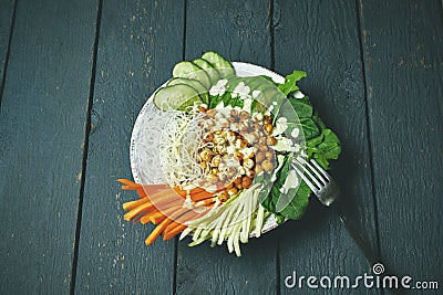 Buddha bowl with vegan food, fried chickpeas, rice noodles with wegetables Stock Photo