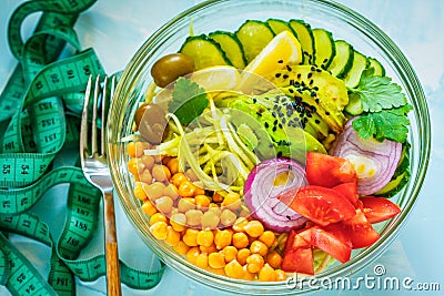 Buddha bowl - zucchini pasta, tape measure centimeter. Stock Photo