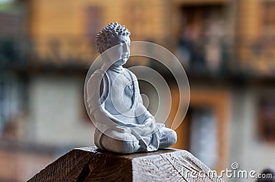 Buddha ceramic statue. Yoga, buddhism, meditation background with empty space for text Stock Photo