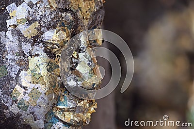 Buddha face covered with gold leaf Stock Photo