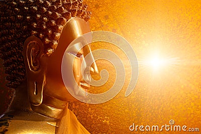 Buddha face head looking at wisdom light calm peace to nirvana way of life in Asian religion concept Stock Photo