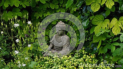 Buddha figure in a Spring Garden Stock Photo