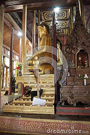 Buddha image and cat at Nga Phe Chaung Monastery Myanmar Stock Photo