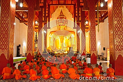 Buddha image and monks Stock Photo