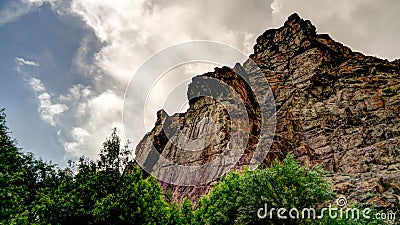 Buddha image on rock over Kar Gah river, Karakorum, Pakistan Stock Photo