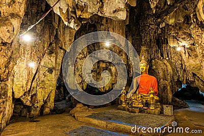 Buddha images in cave Stock Photo