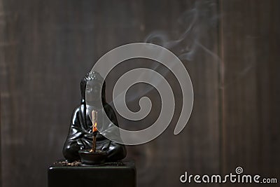 Buddha Incense Holder: Smoking Stock Photo