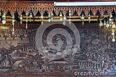 Buddha metal copper carving on wall of Wat Phra That Doi Suthep old temple, Chiang Mai, Thailand Stock Photo