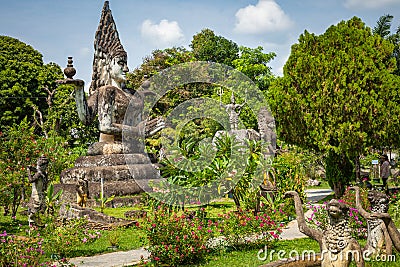 Buddha park Xieng Khouane in Vientiane, Laos. Famous travel tourist landmark of Buddhist stone statues and religious figures Editorial Stock Photo