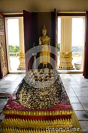 Buddha`s footprints and buddha statue in ubosot for thai people Stock Photo