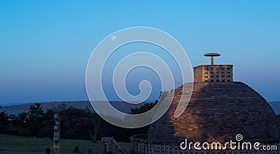 Buddha is smiling-Early morning moon in blue sky on Sanchi Stupa Stock Photo