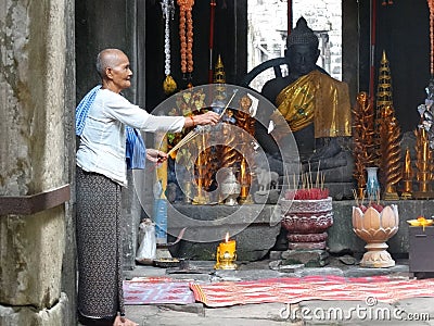 Buddhist monk at Bayon temple, Angkor, Cambodia Editorial Stock Photo