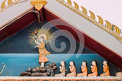 Buddha statue with disciple in temple Stock Photo