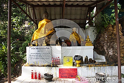 Buddha statue and holy at front of Tham Muang On cave in mountain of Mae On for thai people and foreign travelers travel visit Editorial Stock Photo