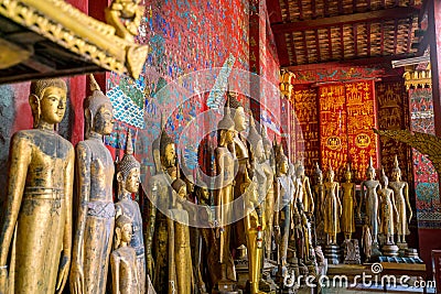 Buddha statues in Wat Xieng Thong in Luang Prabang Stock Photo