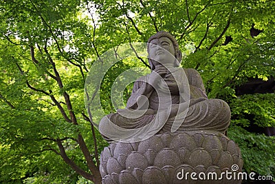 Buddha stone statue Stock Photo