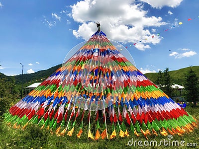 Buddhism colorful prayer flags symbol od spirtual of Tibetan on the mountain with blue sky Stock Photo
