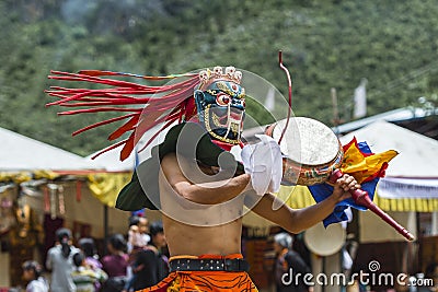 Buddhism protector deity dancing and drumming , Cham Mask dance , Bhutan Editorial Stock Photo