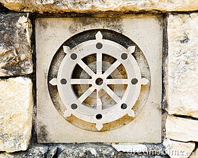 Buddhism's wheel symbol Stock Photo