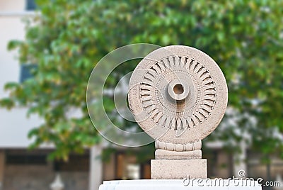 Buddhism wheel with stone Stock Photo