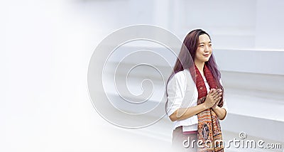 Buddhist asian woman is doing walking meditation around temple for peace and tranquil religion practice concept Stock Photo