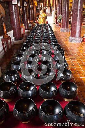 Buddhist bowl for donations in the temple Stock Photo