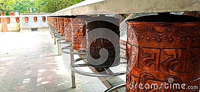 Buddhist Copper prayer drum Sarnath Stock Photo
