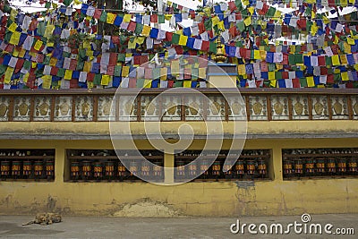 Buddhist drums with mantras and a flags Editorial Stock Photo