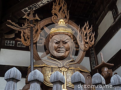 Buddhist guardian deity statue inside the gates of Nankobo, temple number 55 of Shikoku Editorial Stock Photo