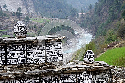 Buddhist mani stones near Dudh Kosi river,Nepal Stock Photo