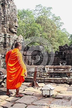 Buddhist monk ancient Bayon temple Angkor, Cambodia Editorial Stock Photo