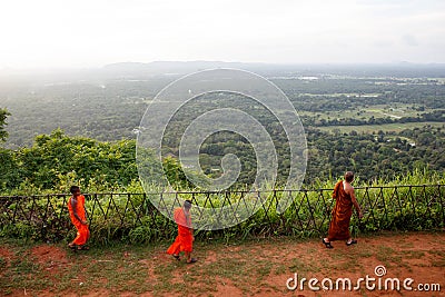 Buddhist Monk at the Citadel of Sigiriya looking towards the forest Editorial Stock Photo