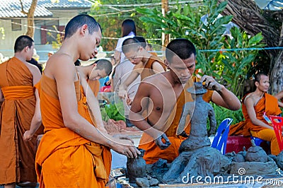 Buddhist young monks doing handcrafts in the temple yard Editorial Stock Photo