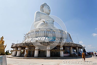 Buddhist monk going to pray at the Big Buddha Temple from white marble Editorial Stock Photo