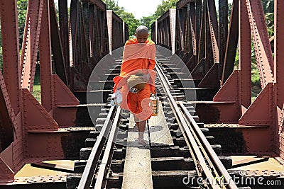 Buddhist monk on a railway bridge in Cambodia Editorial Stock Photo