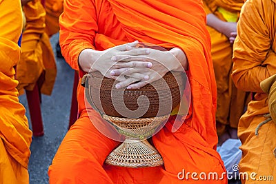 Buddhist monk`s bowl in hands. Stock Photo