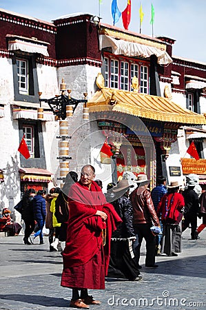 Buddhist monk standing by Khrom Gzigs Khang Editorial Stock Photo