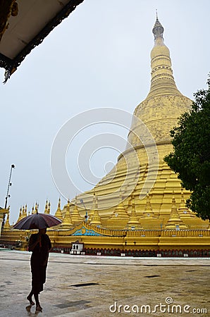 Buddhist or monk walking at Shwemawdaw Paya Pagoda in Bago, Myanmar. Editorial Stock Photo