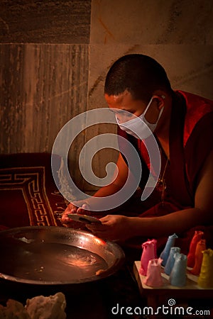 Buddhist Monks from Bhutan make candles in their Bhutan Temple i Editorial Stock Photo