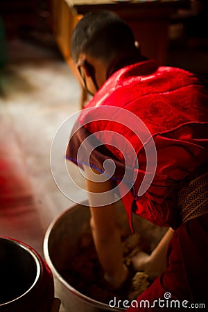 Buddhist Monks from Bhutan make candles in their Bhutan Temple i Editorial Stock Photo