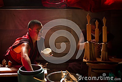 Buddhist Monks from Bhutan make candles in their Bhutan Temple i Editorial Stock Photo