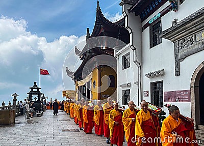 Buddhist monks conducting rite at Ancient Sutra Worship Platform on Tiantai Peak of Mount Jiuhua (Jiuhuashan) Editorial Stock Photo