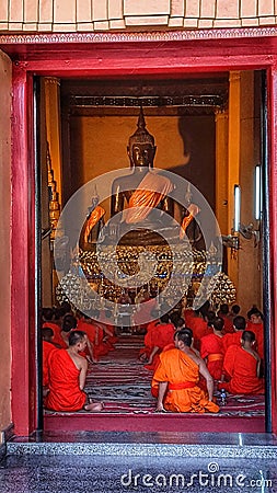 Buddhist monks at prayer, temple, Vientiane, Laos Editorial Stock Photo