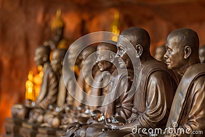 Buddhist monks statues symbol of peace and serenity at Wat Phu Tok temple, Thailand, asceticism and meditation, buddhist art work Stock Photo