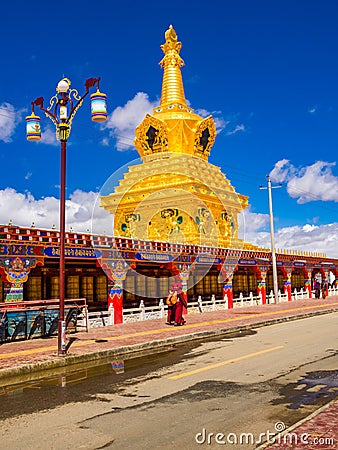 Buddhist nuns walking at the stupas in Yarchen Gar Monastery Editorial Stock Photo