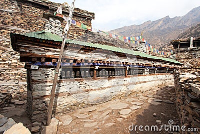 Buddhist prayer many wall with prayer wheels Stock Photo